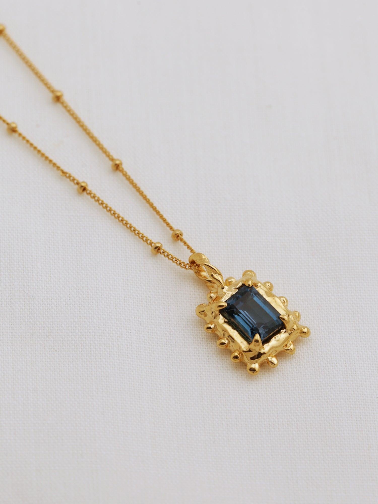 Memento Necklace with Dark Blue Topaz