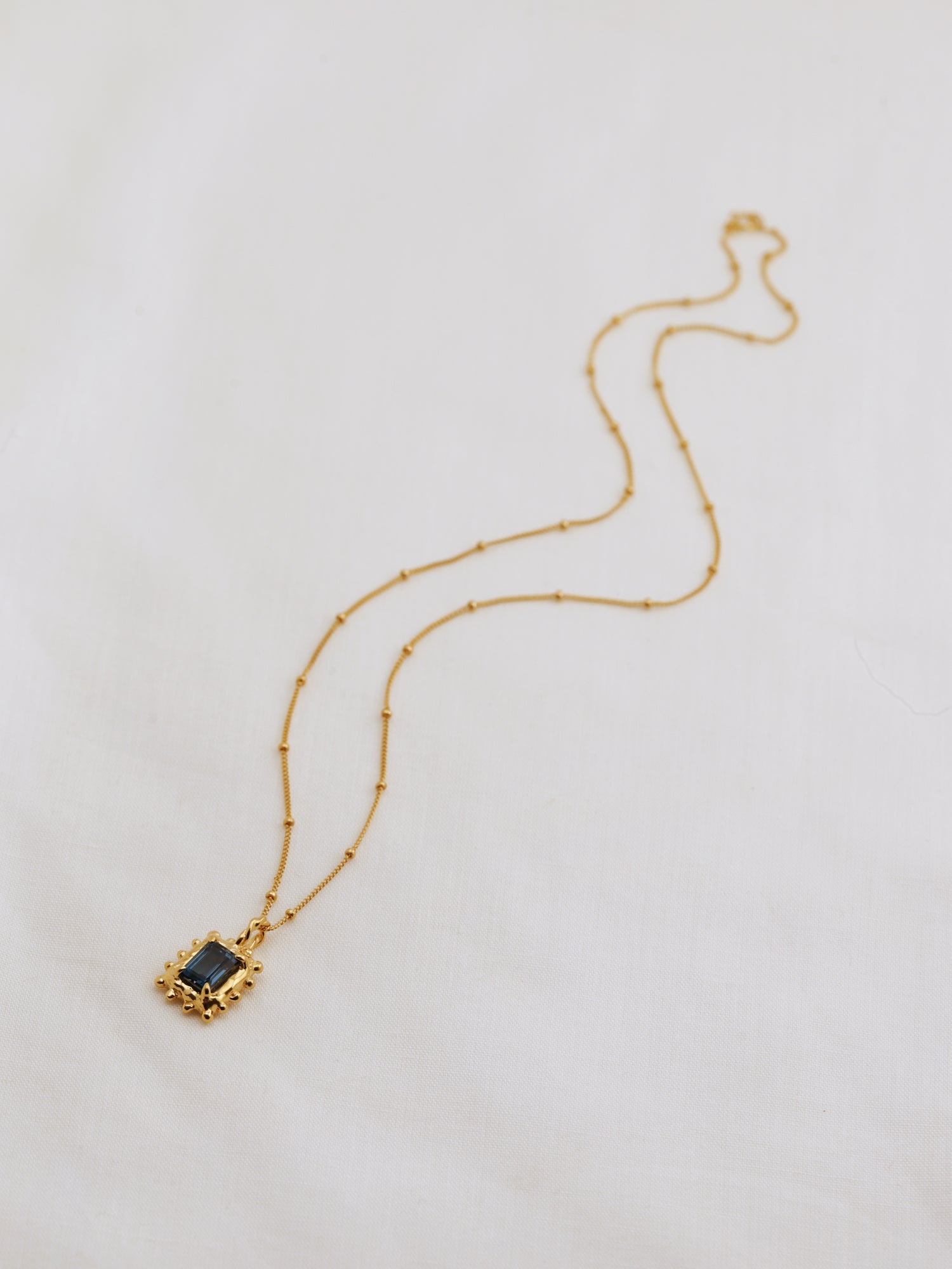 Memento Necklace with Dark Blue Topaz